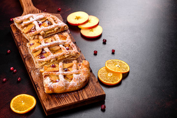 Delicious fresh pie baked with apple, pears and berries