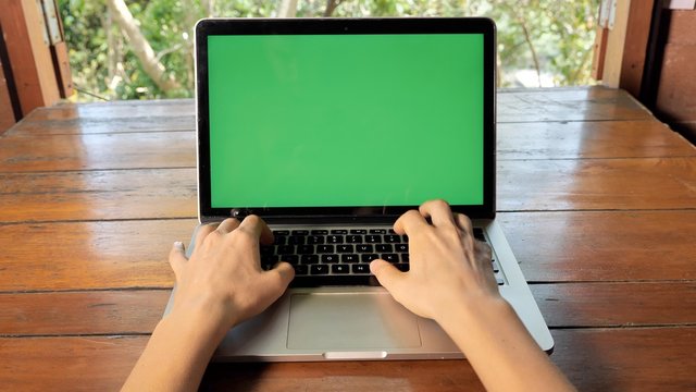 Over The Shoulder Shot Of Female Hands Typing On Laptop Computer Keyboard. Work At Home, Freelancer Concept, Job Project, Writing, Web Communication, Digital Nomad, Green Screen