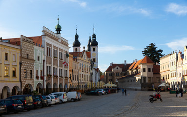 Fototapeta na wymiar Main square of Telc overlooking church bell towers