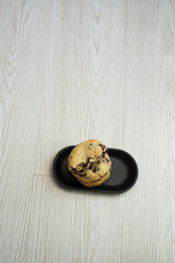 Fototapeta na wymiar Soft and chewy chocolate chip cookies on a wooden table