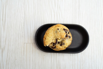 Soft and chewy chocolate chip cookies on a wooden table