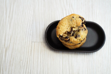 Soft and chewy chocolate chip cookies on a wooden table
