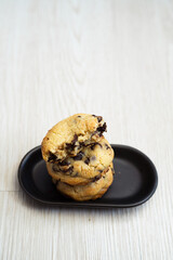 Soft and chewy chocolate chip cookies on a wooden table