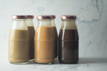 Different beverage coffee, cocoa, chocolate and Thai milk tea bottle