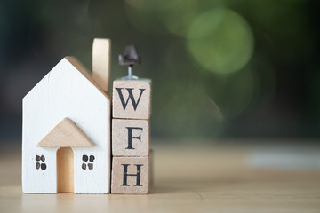 Miniature chair put on wood block WFH with wood home