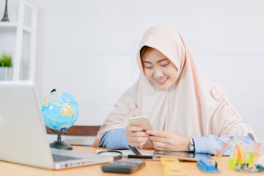 Stem educations in classroom, Muslim woman working laptop computer ,female Student learning scientist education class makes electronic chemistry experiment lab. STEM ,mechanic,chemistry test, biology.
