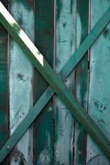 Background image. Green fence in the open air.
