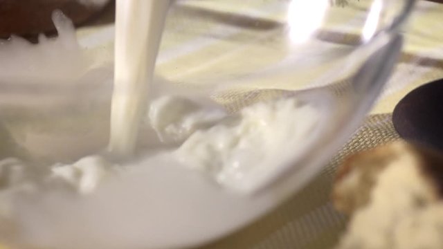 stock footage pour milk from a jug, slow motion