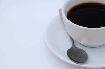Black Coffee on white background. Top view with morning sunlight