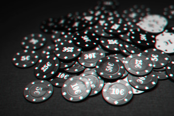 jackpot of poker chips on the green table close-up