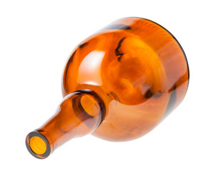overturned empty wide brown liquor bottle isolated