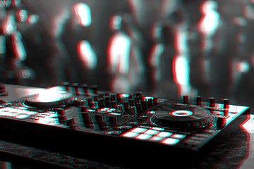professional DJ mixer controller at a concert in a nightclub