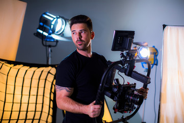 Attractive man with movie camera