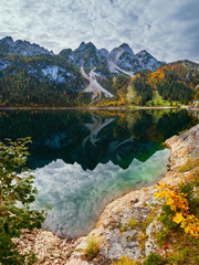 Autumn alpine lake with clear transparent water and reflections. Gosauseen  lake, Austria.