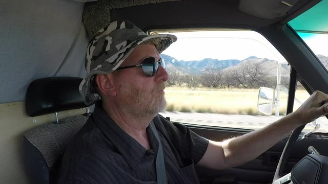 Profile Senior Man Driving RV Camper Truck