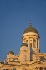 Fototapeta na wymiar Closeup of top of Helsinki Cathedral in Finland with blue sky background