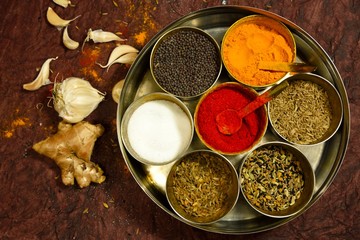 various spices in bowls