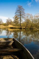 row boat towed to lake shore fishing