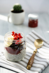 Delicious wholesome breakfast with seeds with omega fats and red pomegranate berries
