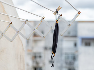 Washable face mask hanging after washing. Protection against Coronavirus