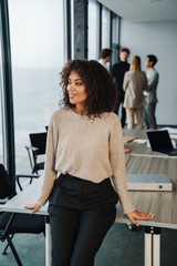 Beautiful young smart businesswoman standing
