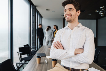Attractive young confident businessman in formal wear