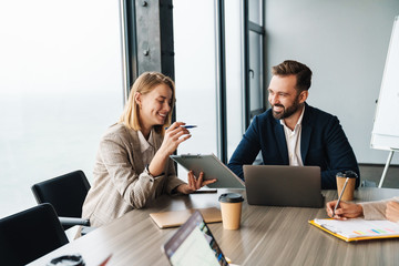 Group of smart motivated businesspeople working together