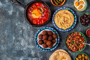 Falafel, hummus, shakshuka, Israeli salad - traditional dishes of Israeli cuisine.