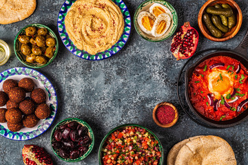 Falafel, hummus, shakshuka, Israeli salad - traditional dishes of Israeli cuisine.