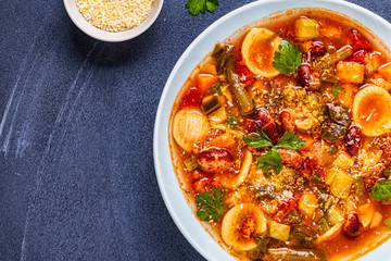 Minestrone, italian vegetable soup with pasta and beans.
