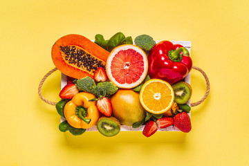 Fruits and vegetables rich in vitamin C in box. Healthy eating.