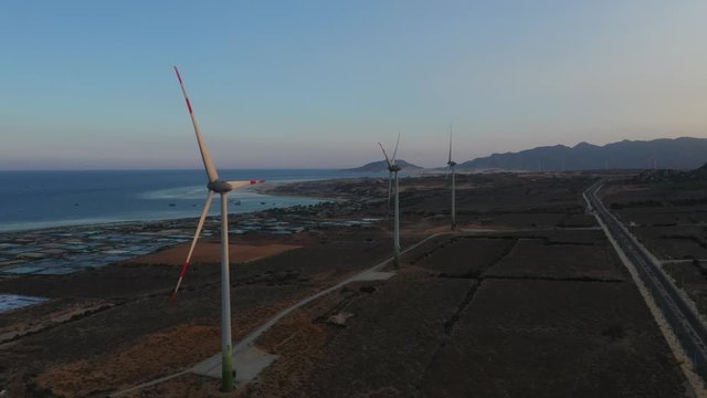 Aerial view of windmills farm for energy production, Mui Dinh, Ninh Thuan, Vietnam. Wind power turbines generating clean renewable energy for sustainable development