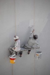 worker painting a wall