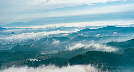 Obraz premium Beautiful Landscape of mountain layer in morning sun ray and winter fog at Doi Sa Ngo mountain in Chiang Saen district of Chiang Rai province of Thailand