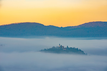 the church on the hill and the fog on the trees - 341917017