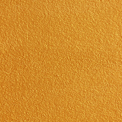Gold paint on cement wall texture or backgrond
