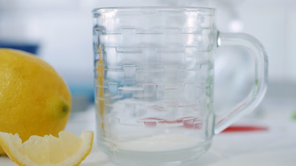 Fresh Sweet and Hot Cup with Tea and a Slice of Lemon at Breakfast Time in the Morning