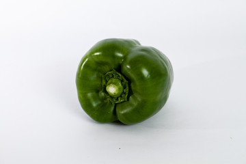 perfect green bell pepper on a white backdrop.