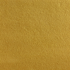 Gold paint on cement wall texture or backgrond