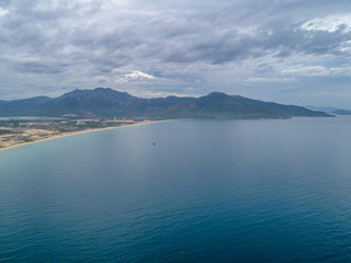 Aerial view of Bai Dai beach at Cam Ranh Bay, owns spectacular landscape which has smooth white sand and clean blue sea. Bai Dai will become a key tourist site in the South of Khanh Hoa