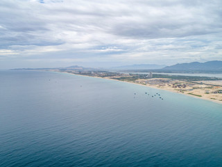 Fototapeta na wymiar Aerial view of Bai Dai beach at Cam Ranh Bay, owns spectacular landscape which has smooth white sand and clean blue sea. Bai Dai will become a key tourist site in the South of Khanh Hoa