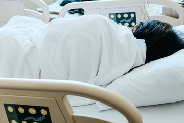 Image of Elderly patients in hospital bed