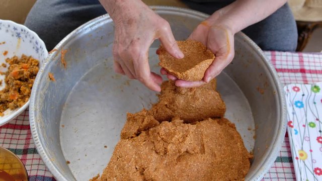 Traditional Turkish Food; Stuffed Meatballs,  Turkish known as "icli kofte". Woman making Stuffed Meatballs at home.