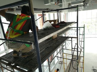 Construction workers on steel scaffolding Work in construction areas