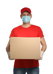 Fototapeta na wymiar Courier in protective mask and gloves holding cardboard box on white background. Delivery service during coronavirus quarantine