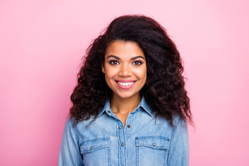 Fototapeta premium Portrait of charming cute girlish afro american gir look good in camera wear casual style clothing isolated over pink color background