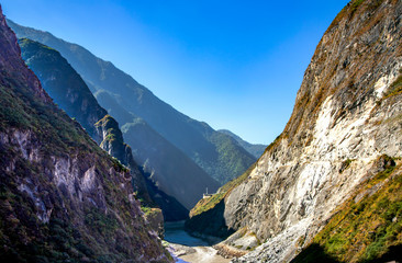 Fototapeta na wymiar Hu Tiao or Tiger Leaping Gorge is believed to be the worlds deepest canyon. Canyon on the Jinsha River, a primary tributary of the upper Yangtze River. It is located 60 kilometres 37 mi north of Lijia