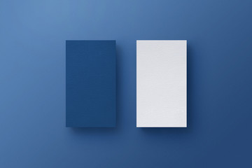 Business card on blue background. Retouch