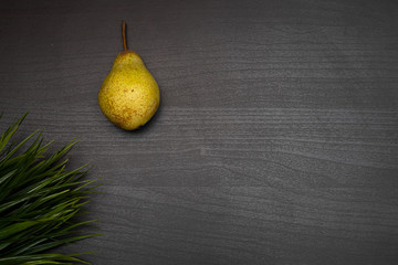 fresh fruit on dark wooden table representing healthy food