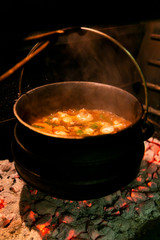 Black Potjie Food South African pot with fire